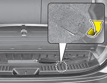 Your spare tire is stored underneath your vehicle, directly below the cargo area.